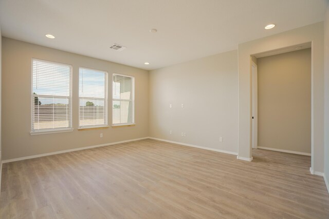 6209 Angelou Ln NW, Albuquerque, NM 87120 - unfurnished room featuring light wood-style floors, baseboards, and recessed lighting