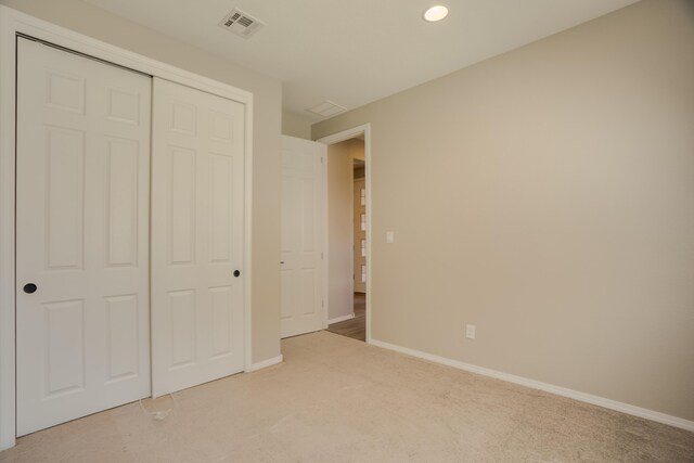 6209 Angelou Ln NW, Albuquerque, NM 87120 - unfurnished bedroom with carpet, baseboards, a closet, and recessed lighting