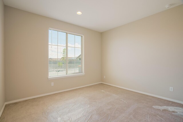 6209 Angelou Ln NW, Albuquerque, NM 87120 - empty room with light colored carpet, recessed lighting, and baseboards