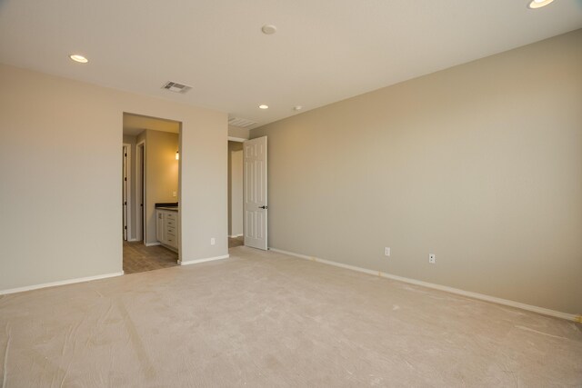 6209 Angelou Ln NW, Albuquerque, NM 87120 - unfurnished bedroom with light colored carpet, recessed lighting, baseboards, and ensuite bath