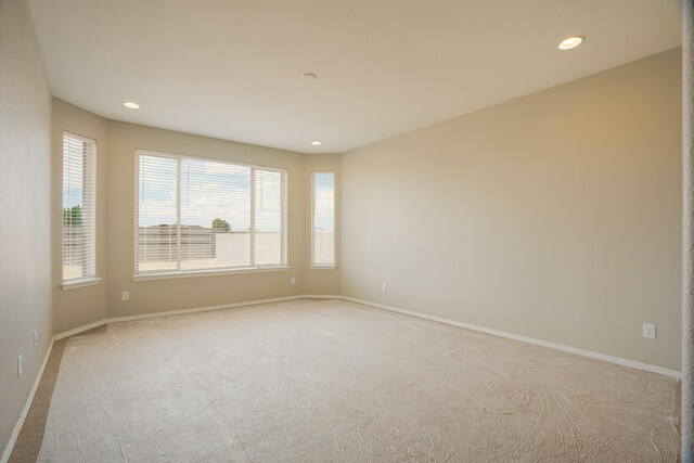 6209 Angelou Ln NW, Albuquerque, NM 87120 - unfurnished room featuring light carpet, recessed lighting, healthy amount of natural light, and baseboards