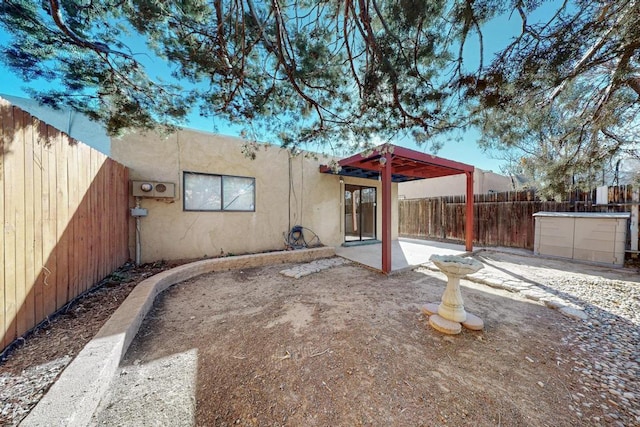 back of house featuring a patio area, a fenced backyard, and stucco siding