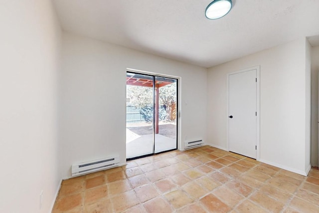 empty room featuring a baseboard radiator and baseboards