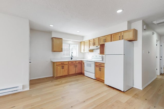 kitchen with light countertops, light wood-style flooring, a sink, white appliances, and under cabinet range hood