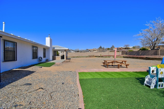 view of yard with a patio and fence