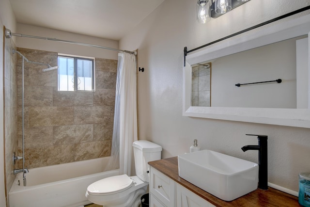 full bath featuring vanity, shower / tub combo, and toilet