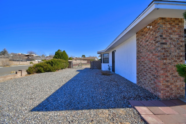 view of yard featuring a gate and fence