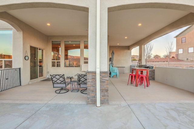 view of patio featuring outdoor dining area