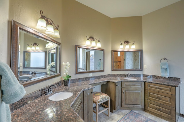 bathroom with tile patterned flooring and vanity