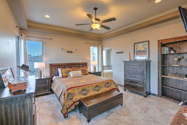 bedroom featuring ceiling fan, recessed lighting, a raised ceiling, and ensuite bathroom