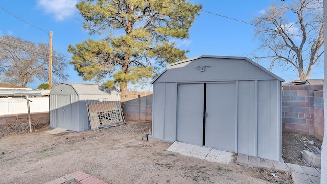 view of shed with a fenced backyard