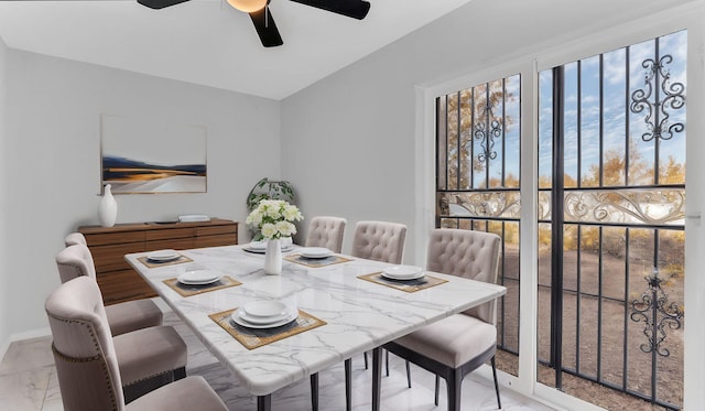 dining space with a wealth of natural light, baseboards, marble finish floor, and ceiling fan