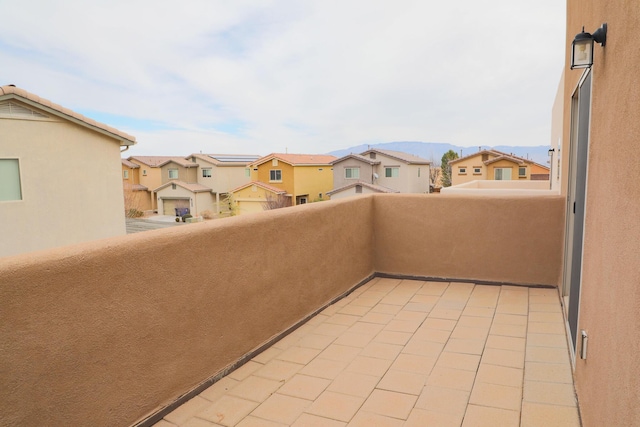 balcony with a mountain view and a residential view