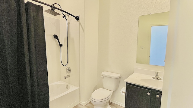 bathroom with shower / tub combo, vanity, and toilet