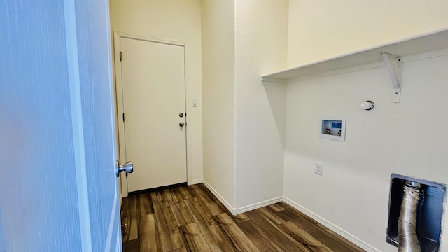 clothes washing area with laundry area, dark wood-type flooring, washer hookup, and baseboards