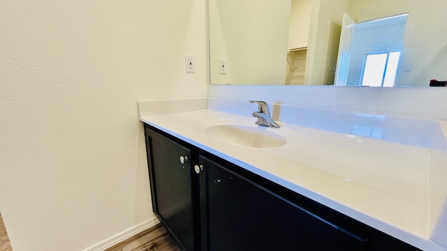 5030 Grace St, Los Lunas, NM 87031 - bathroom featuring vanity and wood finished floors