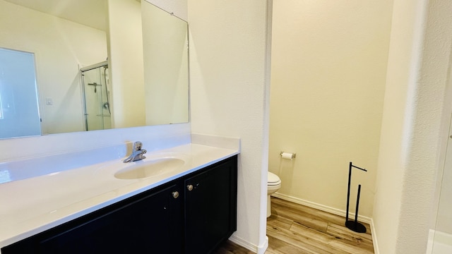 5030 Grace St, Los Lunas, NM 87031 - bathroom with vanity, wood finished floors, and a shower stall
