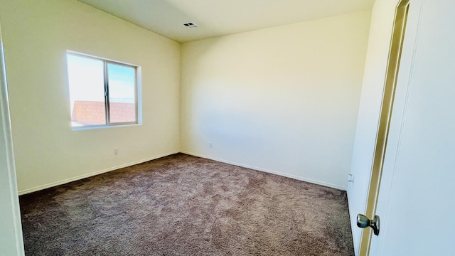 5030 Grace St, Los Lunas, NM 87031 - unfurnished room with dark colored carpet and baseboards