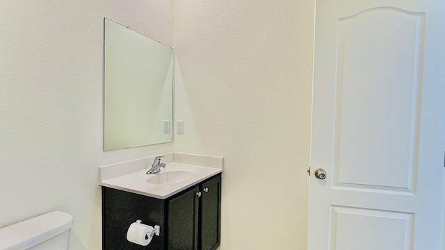 5030 Grace St, Los Lunas, NM 87031 - half bath featuring toilet and vanity
