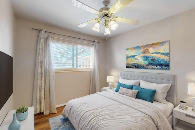 bedroom featuring a ceiling fan and wood finished floors