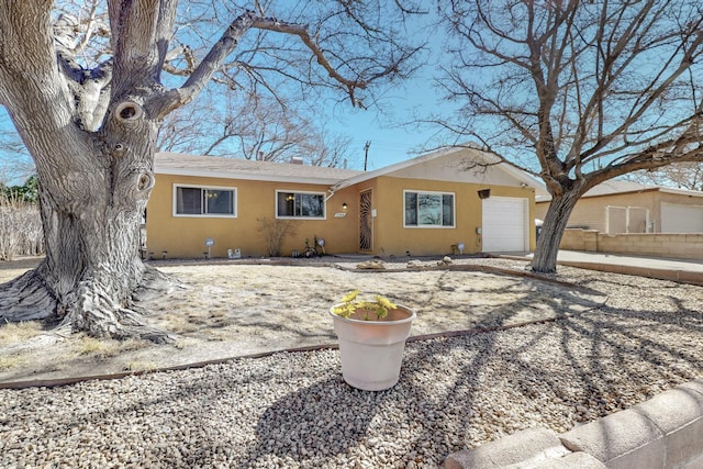 view of front of home featuring an attached garage and stucco siding