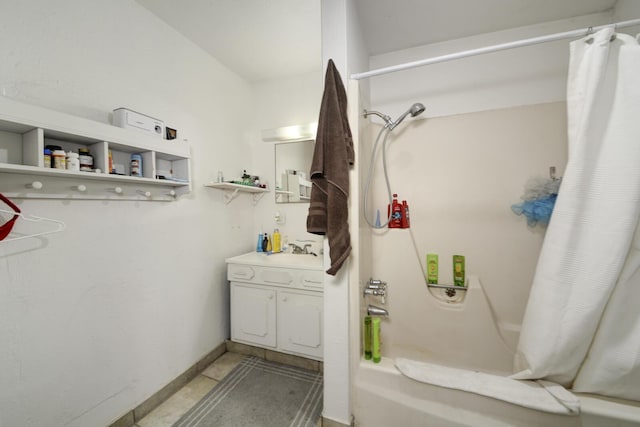 full bathroom with shower / tub combo with curtain, vanity, baseboards, and tile patterned floors