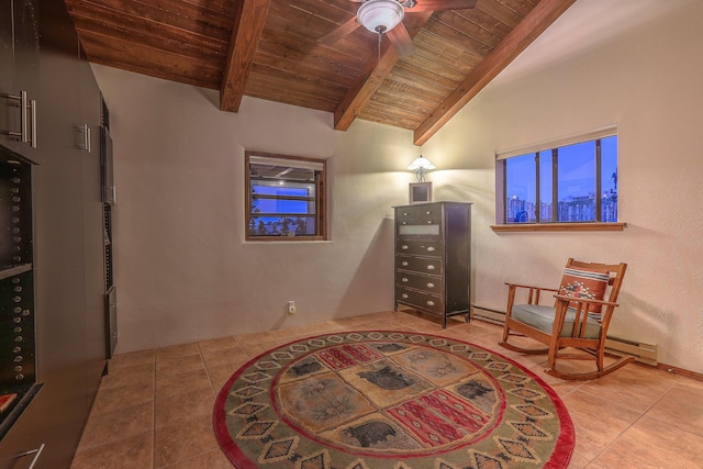 sitting room with lofted ceiling with beams, wooden ceiling, and tile patterned floors