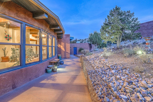 view of side of property featuring a patio