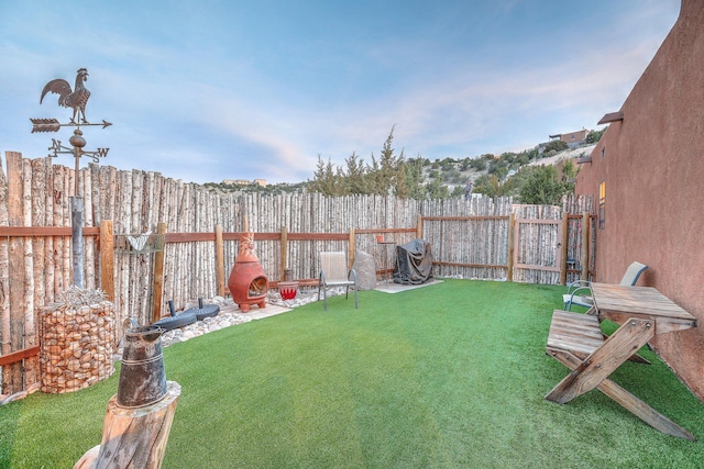 view of yard with a fenced backyard