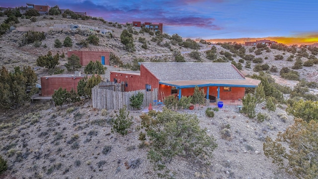 view of front of property featuring fence