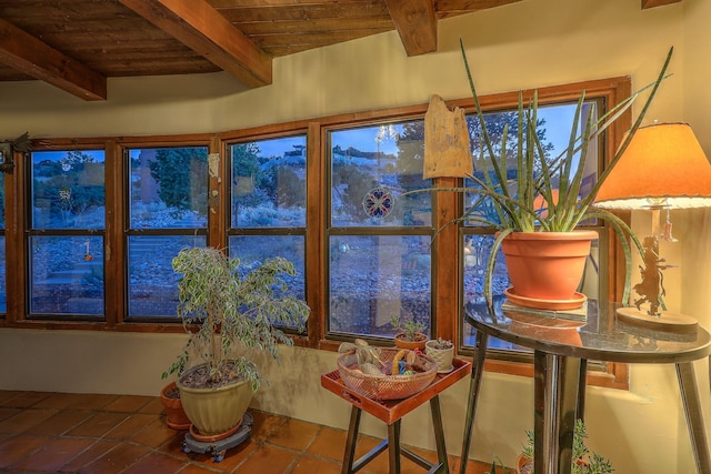 sunroom with beam ceiling and wooden ceiling