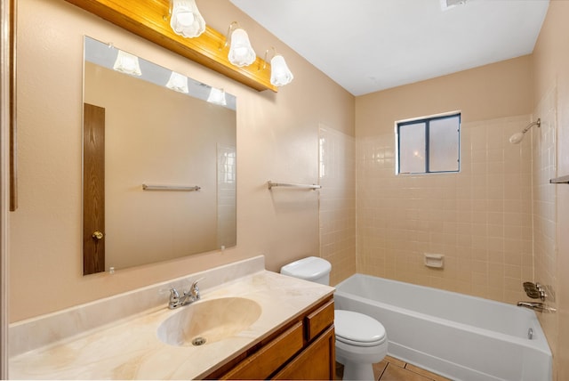 full bathroom featuring toilet, tile patterned flooring, vanity, and shower / bathtub combination