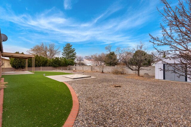 view of yard with a patio and a fenced backyard