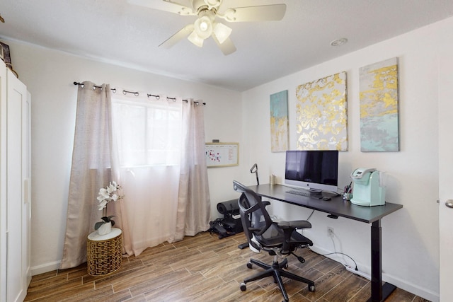 office space featuring wood tiled floor and a ceiling fan