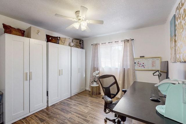 office space with a ceiling fan, a textured ceiling, and wood finished floors