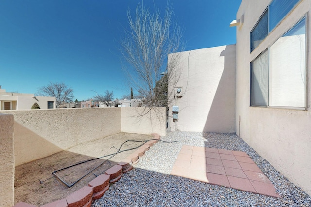 view of yard featuring a patio area and fence