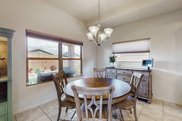 dining room featuring a chandelier, baseboards, and light tile patterned floors