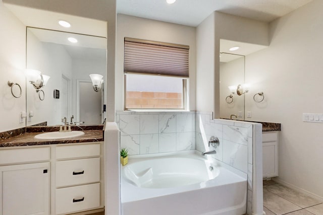 full bath with a garden tub, vanity, tile patterned floors, and recessed lighting