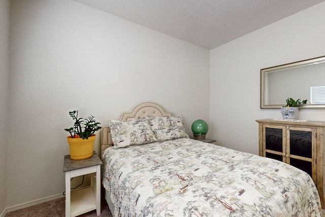 carpeted bedroom with baseboards