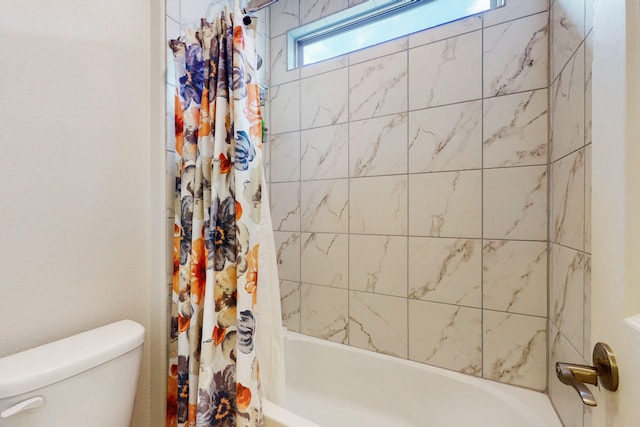 full bath with shower / tub combo and toilet