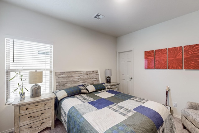 carpeted bedroom with visible vents