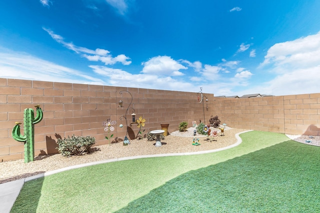 view of yard featuring a fenced backyard