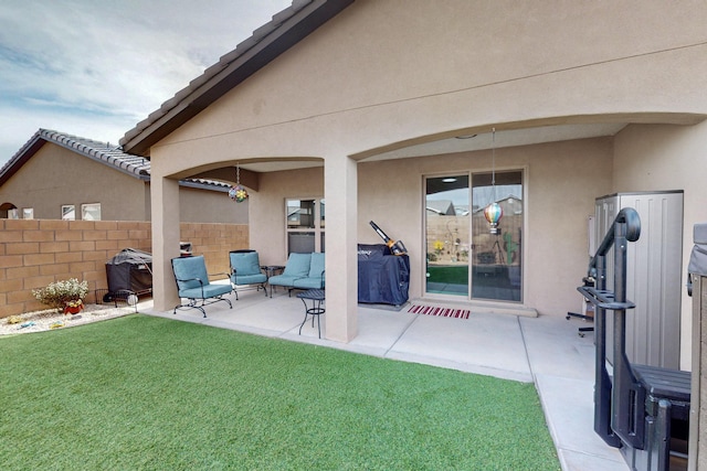 exterior space with an outdoor hangout area and fence