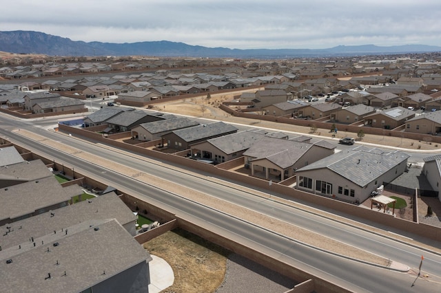 birds eye view of property featuring a mountain view and a residential view