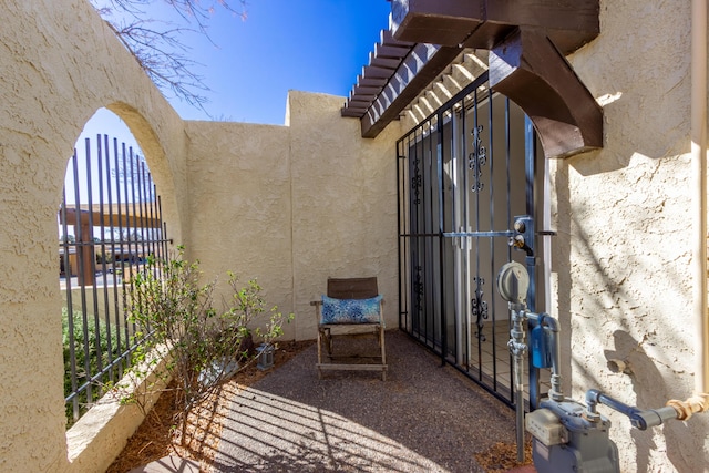 entrance to property featuring stucco siding