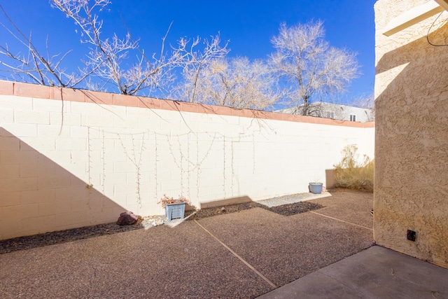 view of yard featuring a fenced backyard and a patio