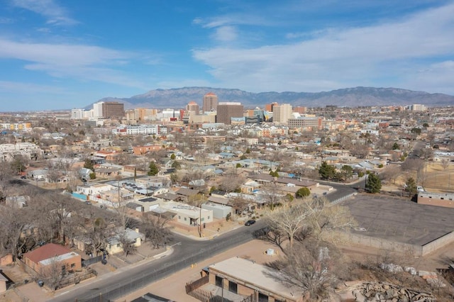 birds eye view of property featuring a city view and a mountain view