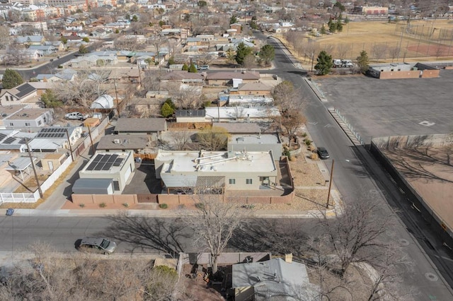 birds eye view of property with a residential view