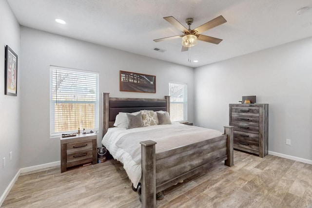 bedroom with light wood-type flooring, baseboards, visible vents, and recessed lighting