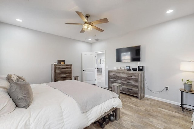 bedroom with recessed lighting, ceiling fan, light wood-style flooring, and baseboards